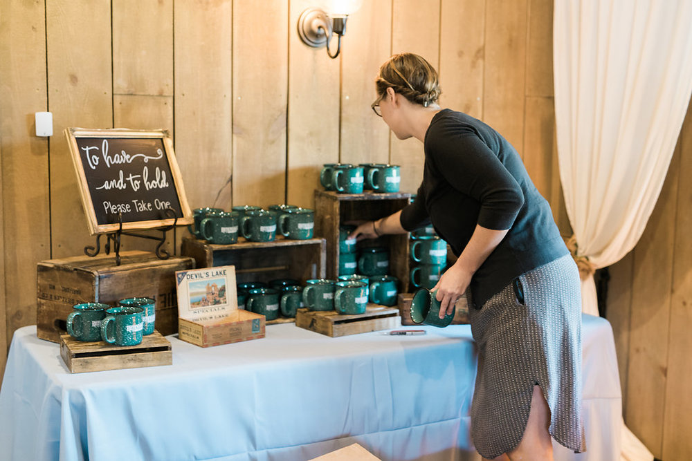  Whitney from Rustic Manor getting all set up! Those camp mugs were such a fun favor for the guests. 
